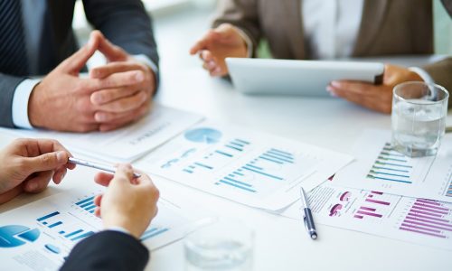 Objects at workplace Image of business documents, pen and glasses on workplace during meeting of partners